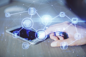 Double exposure of social network sketch hologram and woman holding and using a mobile device.