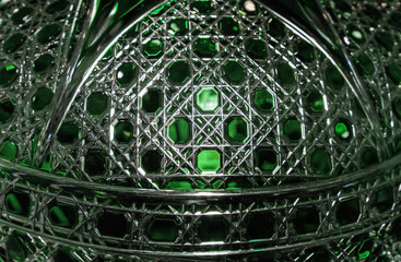 Background from a crystal plafond with faceting and green illumination.