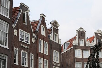 Fototapeta na wymiar Amsterdam Historic House Gables at Begijnhof