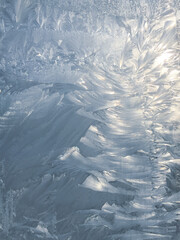 Beautiful frosty patterns on the window. Natural textures.