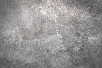 abstract pattern of grainy surface. weathered and uneven gray wall with gradient