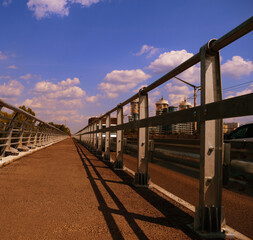 The road is asphalt new on a bridge in the city. City landscape of the capital. The infrastructure is modern