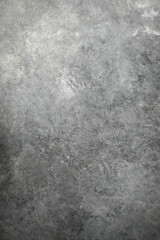 textured dark background with scratches, scuffs and stains. blank backdrop of gray color for copy space
