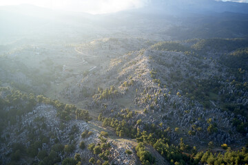 Aerial panoramic view of foggy morning mountain scene.