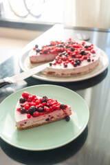 Greek yogurt berry birthday cake and champagne for kids on a dark caffe table