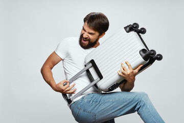  guy go on a trip and a suitcase in the form of a guitar