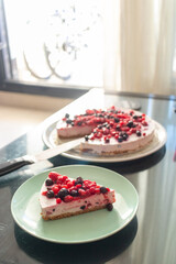 Greek yogurt berry birthday cake and champagne for kids on a dark caffe table