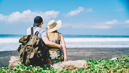 Travelling couple spending weekend on sunny beach