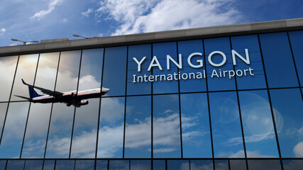 Airplane landing at Yangon Myanmar airport mirrored in terminal