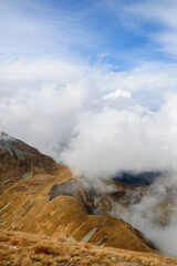 Mountain landscape. Panoramic view from Bystrá peak on Klin peak. Autumn colored mountains with snow. Western Tatras, High Tatras national park, Slovakia. 