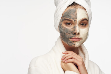 A beautiful girl with a mask against black dots on her face