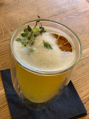 Ginger tea drink with herbs and candized lemon