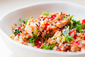 Poke with salmon and vegetables. Hawaiian dish