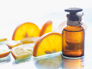 Vitamin c serum and fresh citrus fruits. Citrus essential oil. Natural cosmetics concept. SPA cosmetics with herbal ingredients.