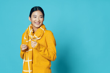 free place Happy woman in a warm sweater and a scarf around her neck