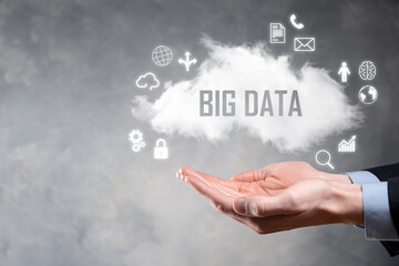 Businessman holds the inscription , word BIG DATA. Padlock , brain ,man, planet,graph, magnifier, gears, cloud, grid, document, letter, phone icon.