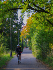 blurred vertical background of cyclists riding on camera