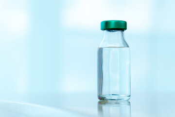Close up vaccines fight against virus, doctor or scientist in laboratory holding a syringe with liquid vaccines.