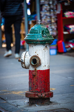 Fire hydrant painted in Italian flag colours. Little Italy, New York City, USA.