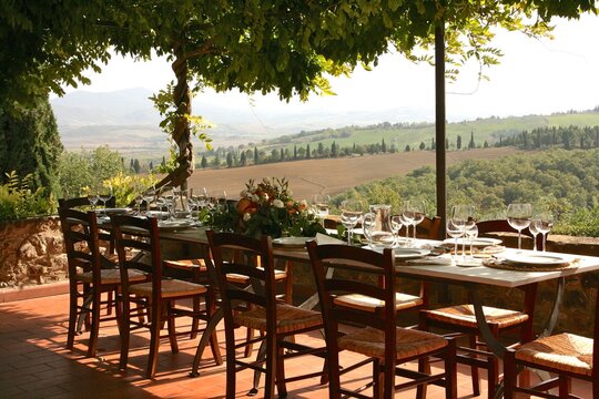 Table Set For Al Fresco Dinner With A View. Tuscany, Italy 