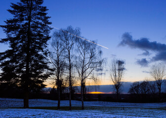 Meteor ina blue sky sunset with snow