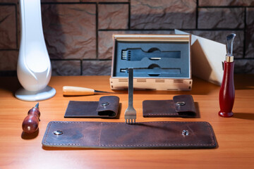 The process of making a genuine leather wallet.