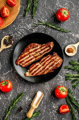 restaurant kitchen with steak preparing on wooden background top view