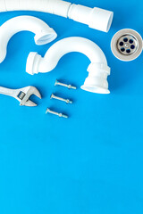 Plumber work with instruments, tools and gear on blue background top view mockup