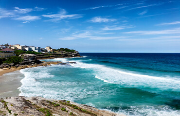 Fototapeta na wymiar Cliffs along empty beach in Sidney Australia coastline