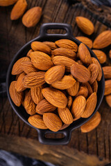 Peeled almonds closeup. For vegetarians. Food background.
