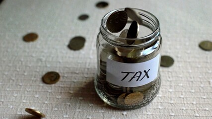 3D illustration - jar being filled with coins for tax