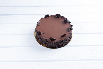 Plate with slice of tasty homemade chocolate cake on table