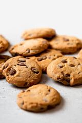 Chocolate cookies on a gray concrete background top view. Free space for text. Cookies background.