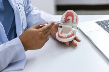 Dentist examining a patient teeth medical treatment at the dental clinic.