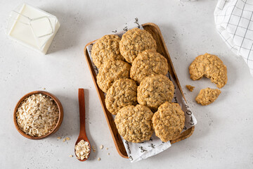 Breakfast with healthy oatmeal cookies on stone background. Top view, flat lay. Cereal biscuits...