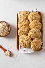 Delicious and crunchy oatmeal cookies on white background. Close up, top view. Recipe, bakery menu, healthy dessert