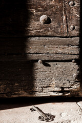 Historical key near a wooden door
