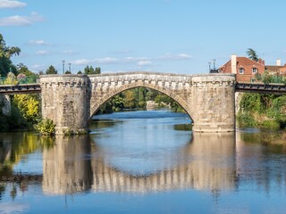 Fototapeta na wymiar reflection of the bridge in the river Gartempe at Montmorillon France