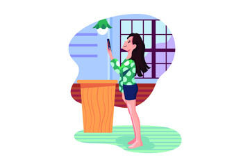 Woman controlling kitchen appliances with a smart phone.