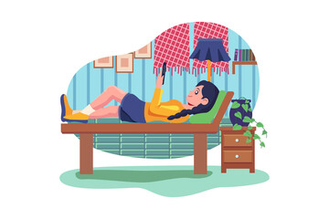 Smiling Young Woman Lying On Bed Listening To Music On Wireless Speaker