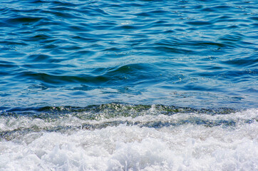 Soft wave of sea on sandy beach. Background.
