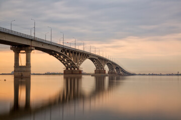 Naklejka na ściany i meble Bridge over the river Volga in sunset. The bridge connects Saratov and Engels. Russia