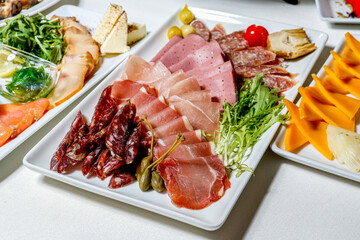 Meat snacks whith greens at the buffet