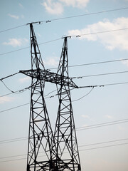 Electricity pylons in a deserted area. High voltage line.