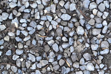Texture of gray stones of medium size and pinched