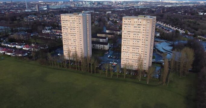 Aerial footage view of high rise tower blocks, flats built in the city of Glasgow to accommodate the increasing population, council housing crisis,
