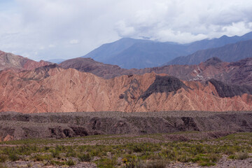 High in the cordillera. View of the colorful rock and sandstone cliffs. The arid desert orange and brown mountains in Tilcara, Jujuy, Argentina.