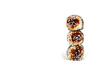 take an unagi maki rolls with bamboo chopsticks on white background, asian food, japanese cuisine