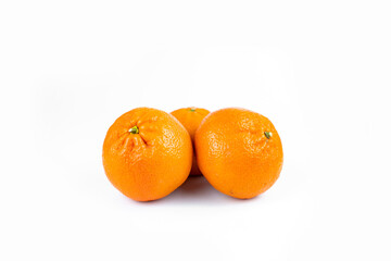Ripe fresh juicy tangerines with leaves on white background