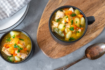 Chicken stew with potatoes, zucchini, and carrots in a bowl